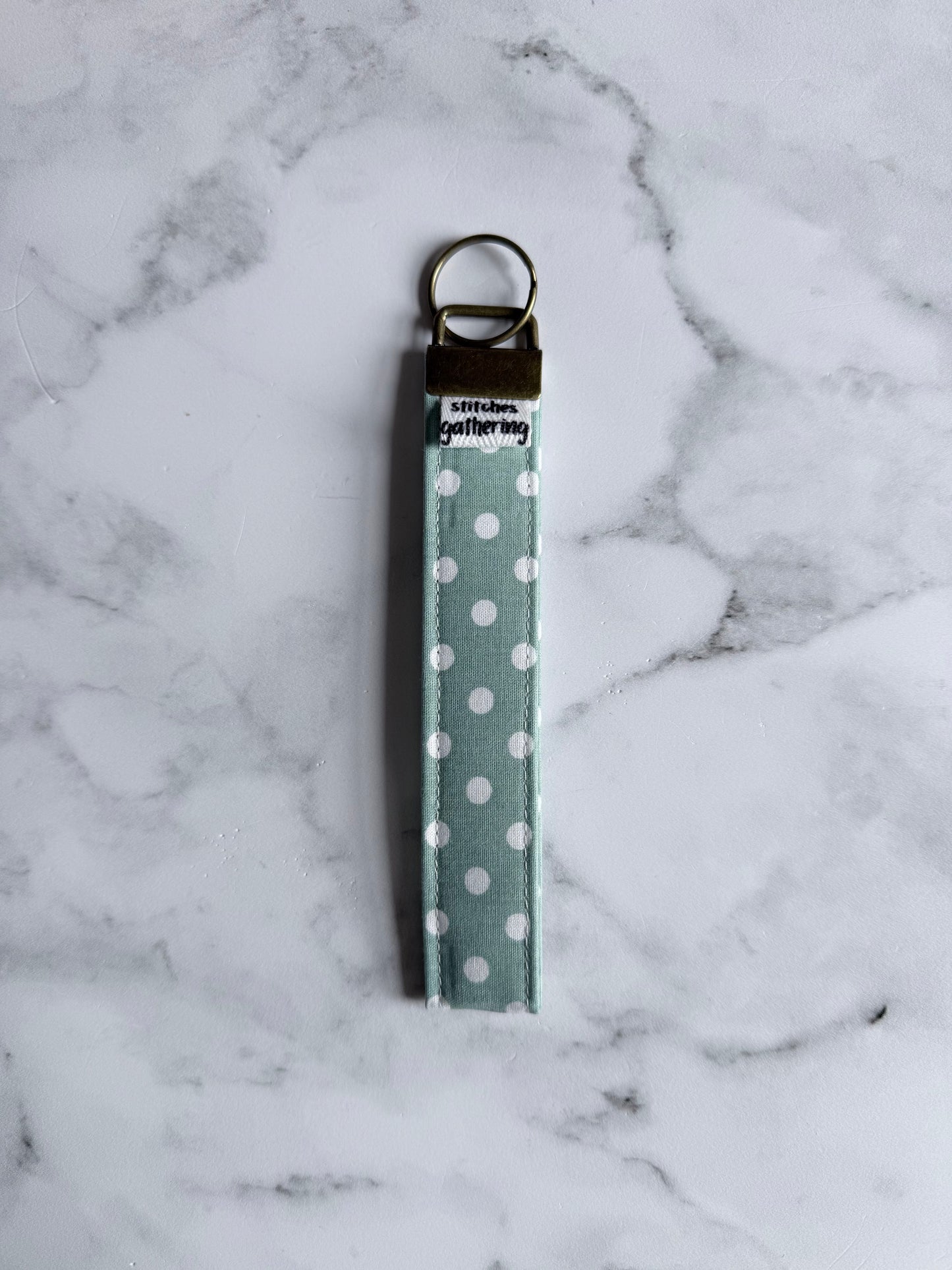SAGE POLKA DOT WRISTLET